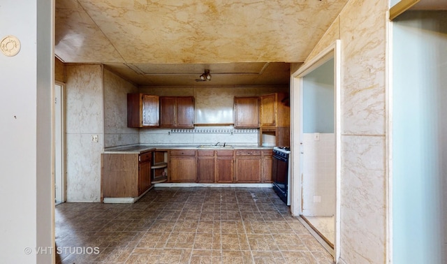 kitchen with sink and black gas range