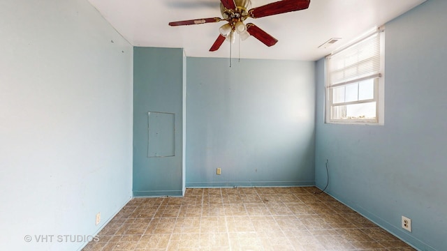 unfurnished room featuring electric panel and ceiling fan