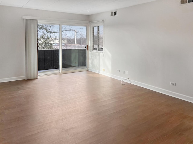 spare room featuring hardwood / wood-style flooring