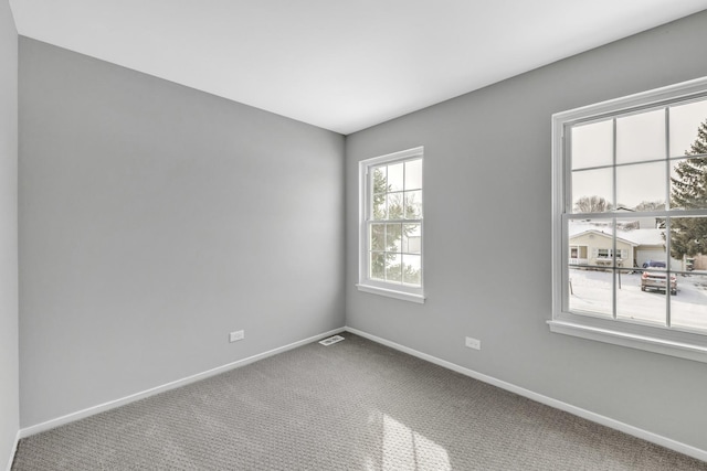 unfurnished room featuring carpet flooring