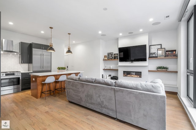 living room with light hardwood / wood-style flooring