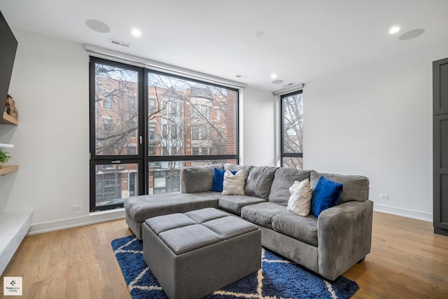 living room with light hardwood / wood-style flooring