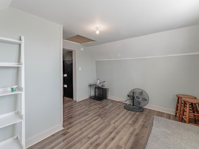 misc room with lofted ceiling and light hardwood / wood-style flooring