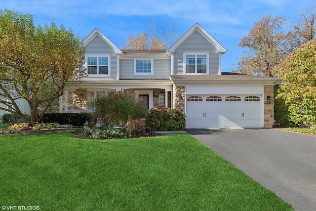 view of front facade with a garage and a front lawn