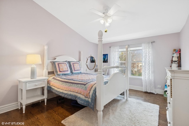 bedroom with ceiling fan, lofted ceiling, and dark hardwood / wood-style floors