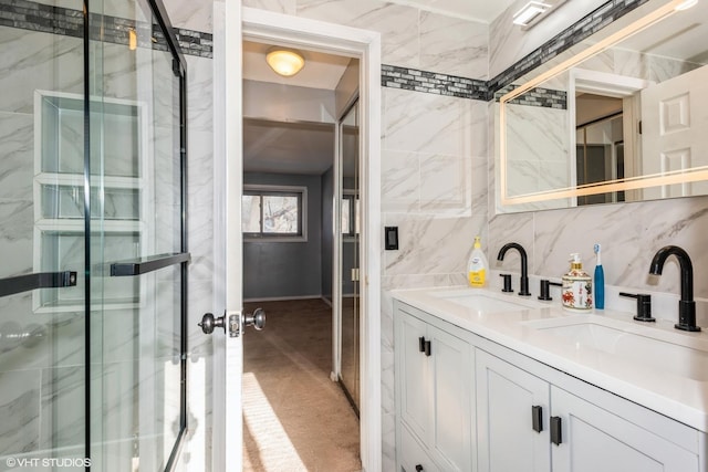 bathroom with vanity, an enclosed shower, and decorative backsplash