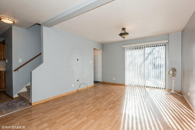 unfurnished living room featuring light wood-type flooring