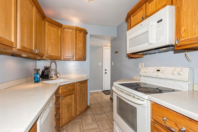 kitchen with sink and white appliances