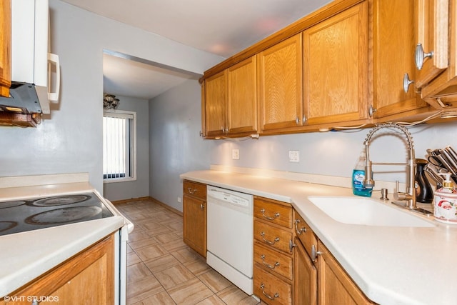 kitchen featuring sink and white appliances