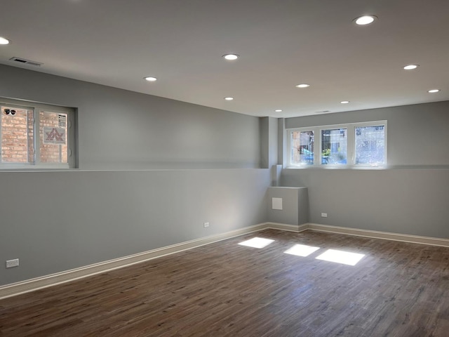 empty room with dark hardwood / wood-style floors