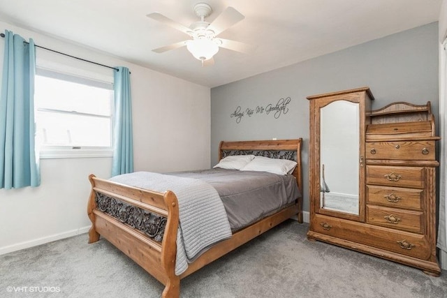 bedroom featuring ceiling fan and light colored carpet