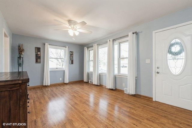 foyer entrance featuring light hardwood / wood-style flooring and ceiling fan