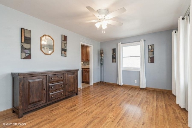 empty room featuring light hardwood / wood-style floors and ceiling fan