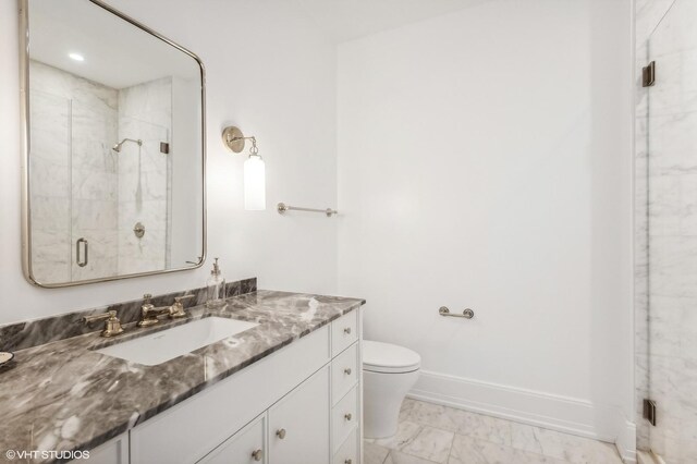 full bath featuring vanity, baseboards, a stall shower, toilet, and marble finish floor