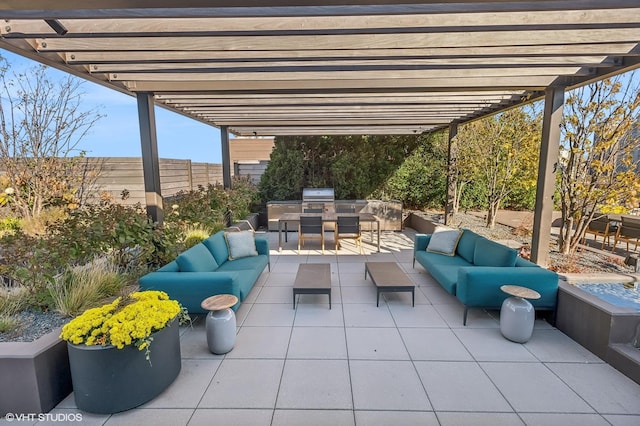 view of patio featuring outdoor dining space, fence, grilling area, exterior kitchen, and an outdoor hangout area