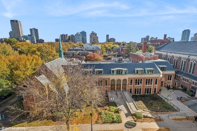 birds eye view of property with a city view