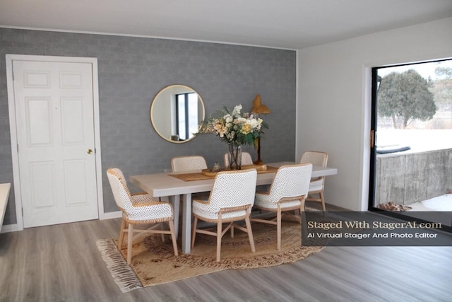 dining space featuring a wealth of natural light and hardwood / wood-style floors