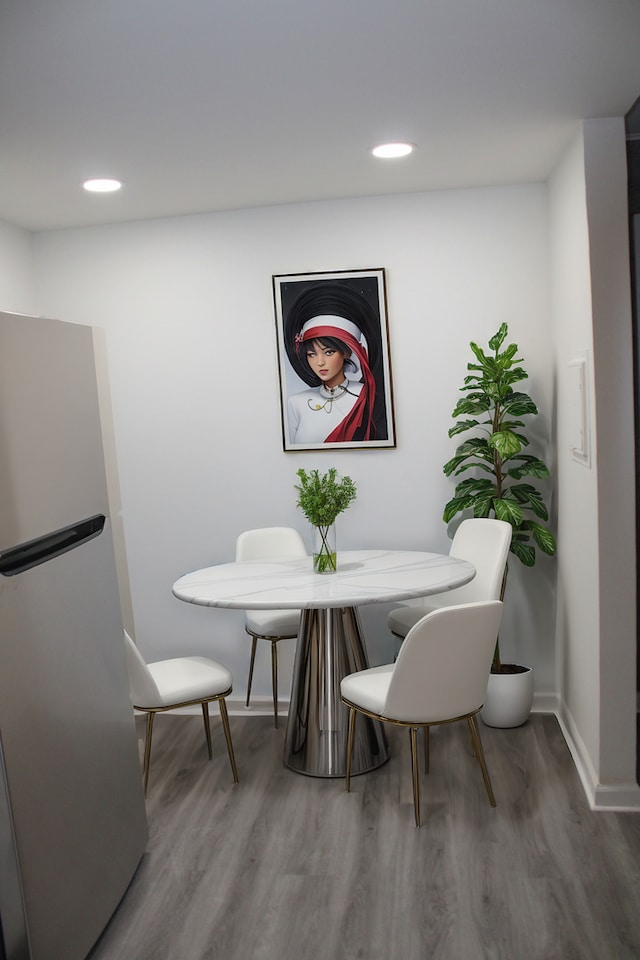 dining area with hardwood / wood-style floors