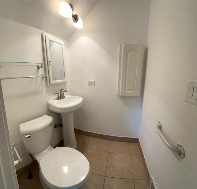 bathroom featuring tile patterned floors and toilet