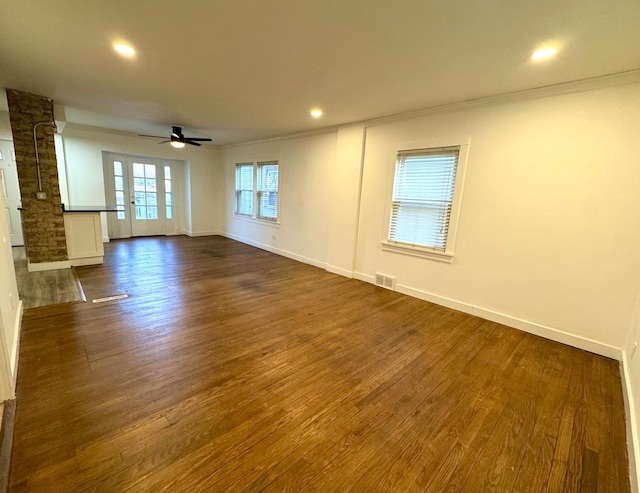 spare room with crown molding, ceiling fan, and dark hardwood / wood-style floors