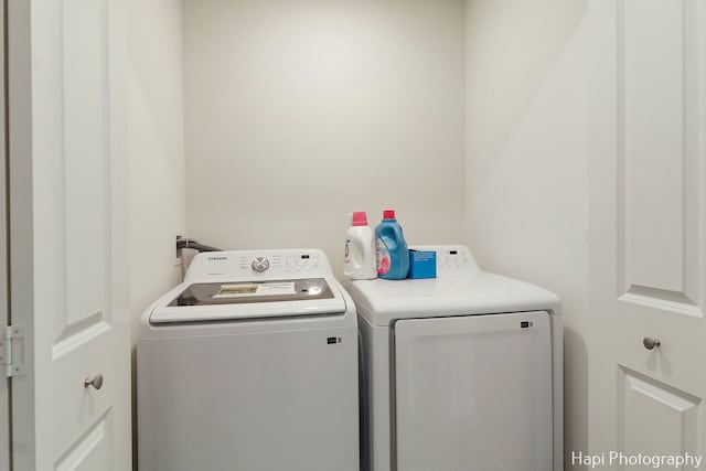 washroom featuring independent washer and dryer