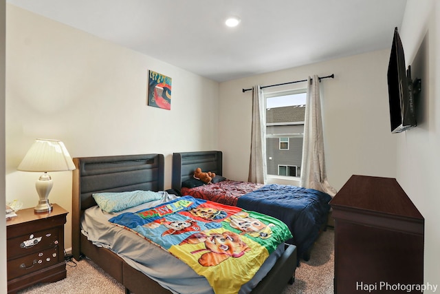 bedroom with light colored carpet