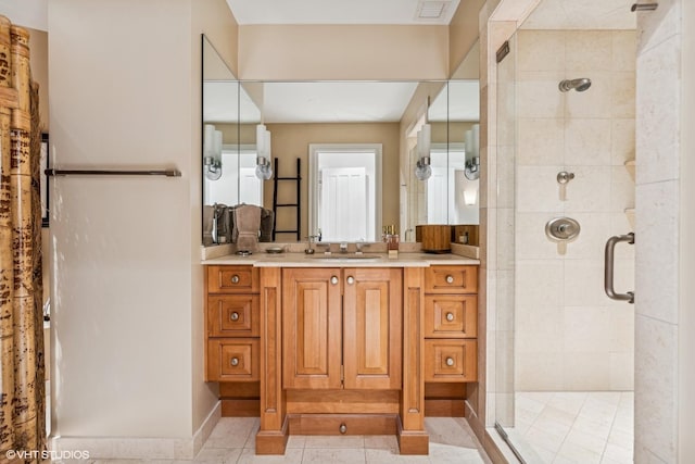 bathroom with walk in shower, vanity, and tile patterned flooring