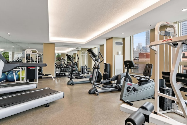 workout area featuring a textured ceiling