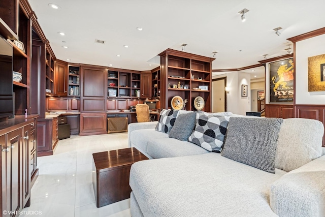 living room featuring crown molding, built in desk, and light tile patterned floors