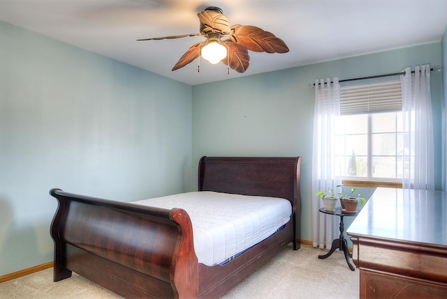 bedroom featuring ceiling fan and light colored carpet