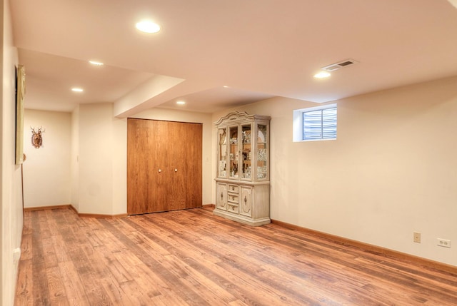 basement featuring hardwood / wood-style floors