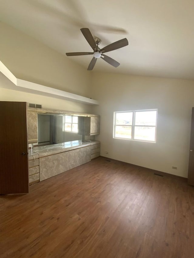 interior space featuring dark wood-type flooring and ceiling fan