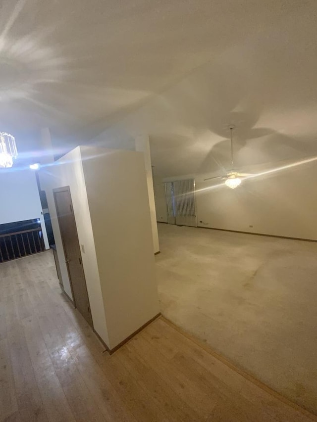 bonus room featuring ceiling fan and light hardwood / wood-style floors