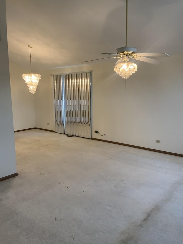 carpeted empty room featuring ceiling fan