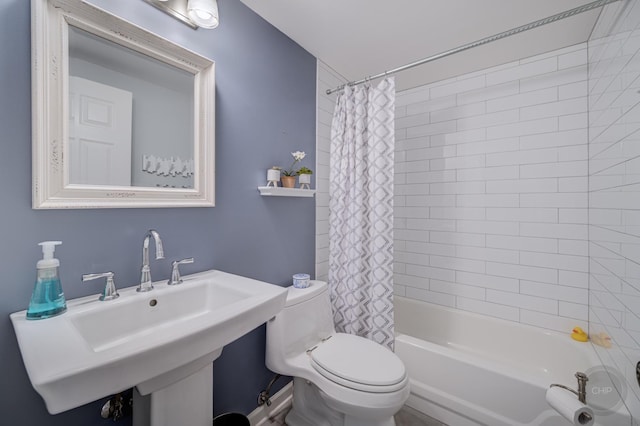 full bathroom with shower / bath combination with curtain, toilet, and sink