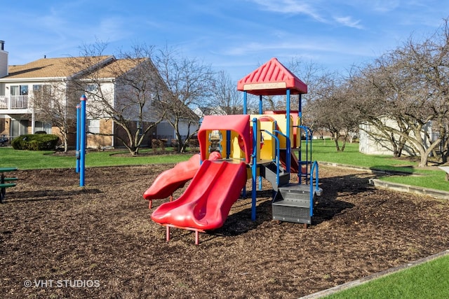 view of jungle gym featuring a lawn