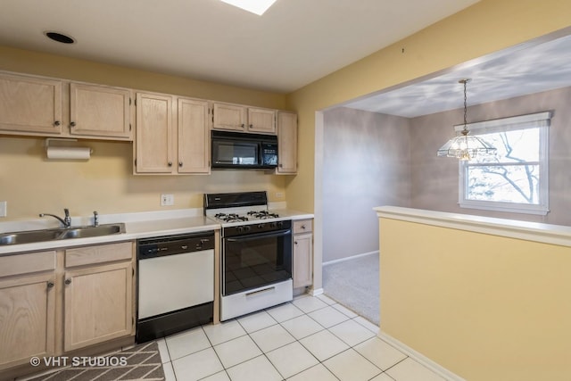 kitchen featuring sink, light brown cabinets, white dishwasher, pendant lighting, and gas range oven