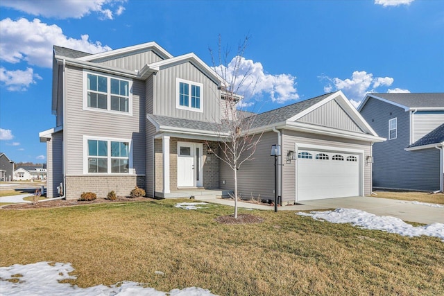 craftsman-style home featuring a garage and a front lawn