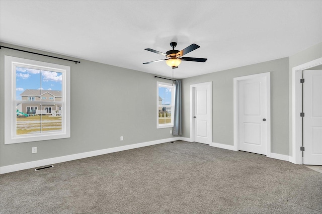 unfurnished bedroom featuring ceiling fan and carpet flooring