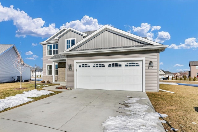 view of front facade featuring a garage and a front lawn