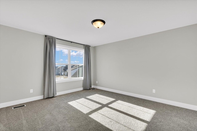 unfurnished room featuring carpet