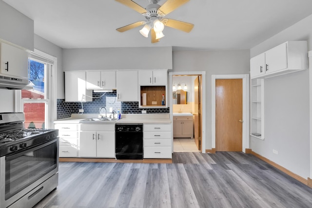 kitchen featuring sink, white cabinetry, black dishwasher, tasteful backsplash, and gas stove