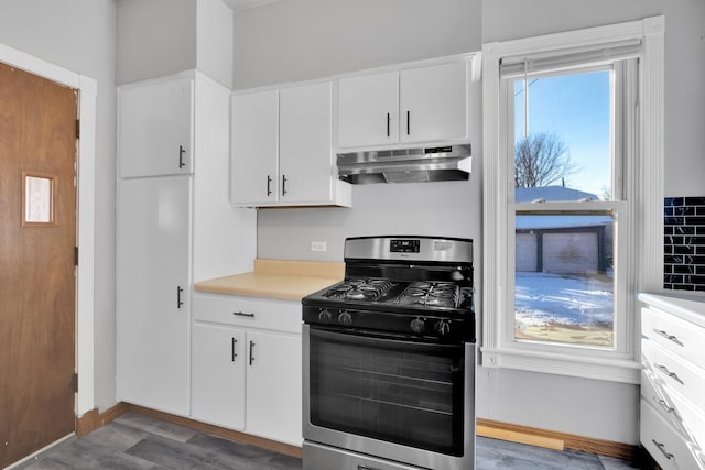 kitchen with white cabinetry, hardwood / wood-style floors, and stainless steel gas stove