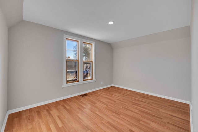 interior space featuring light hardwood / wood-style flooring and vaulted ceiling