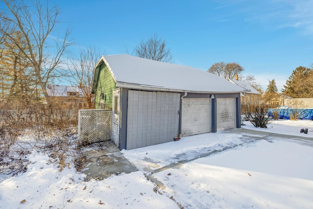 view of snow covered garage