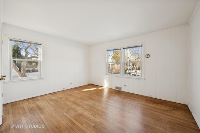 spare room with hardwood / wood-style flooring