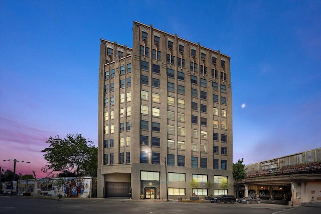 view of outdoor building at dusk