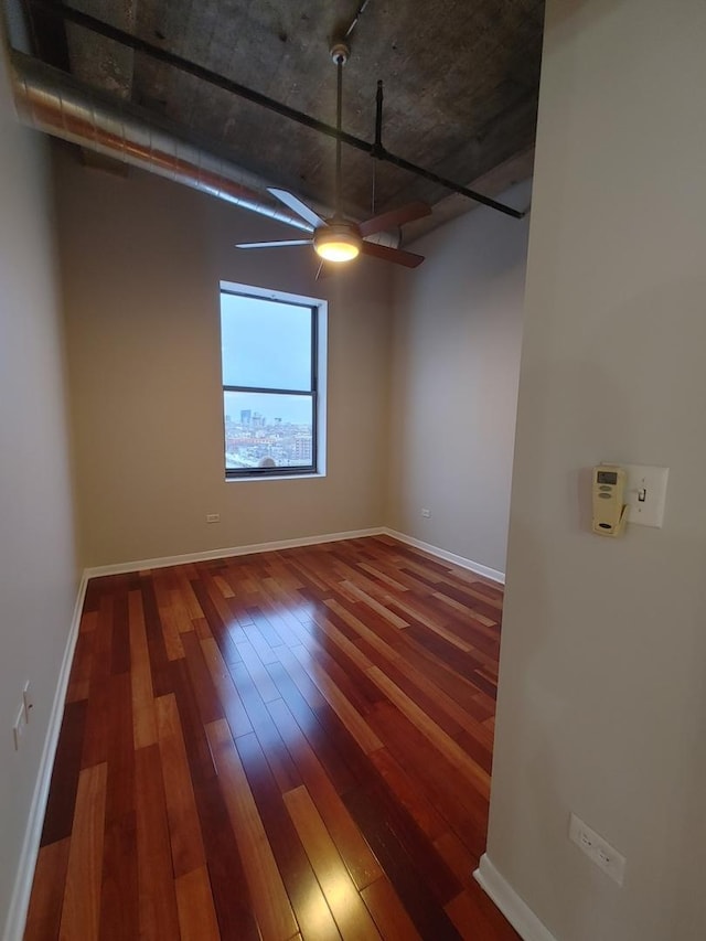 unfurnished room with hardwood / wood-style flooring and ceiling fan