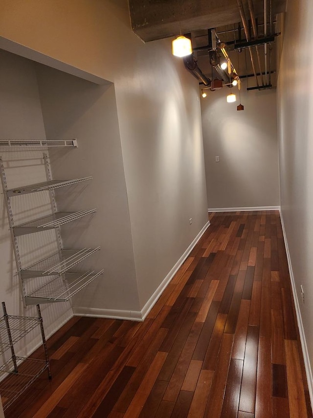 corridor featuring dark hardwood / wood-style floors