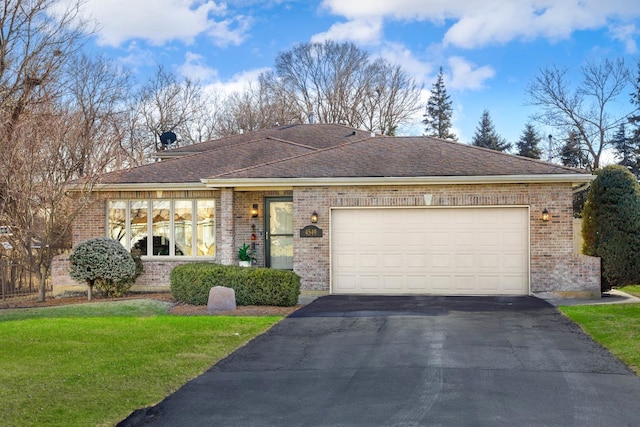 ranch-style home featuring a garage and a front yard